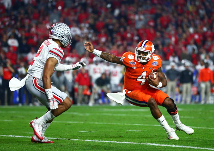 December 31, 2016; Clemson Tigers quarterback Deshaun Watson (4) against Ohio State Buckeyes cornerback Marshon Lattimore (2) in the the 2016 CFP semifinal. Mandatory Credit: Mark J. Rebilas-USA TODAY Sports